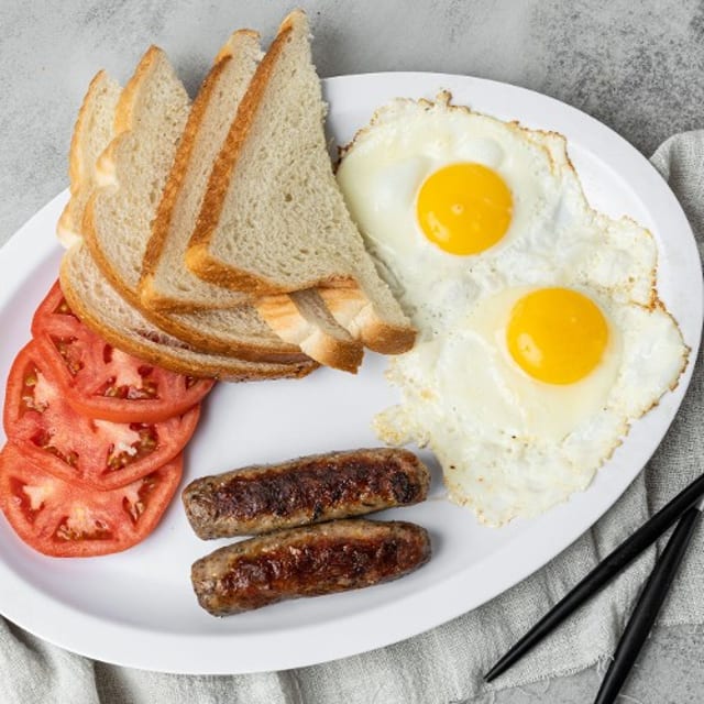 2 Extra Large Eggs with Bacon or Sausage.
